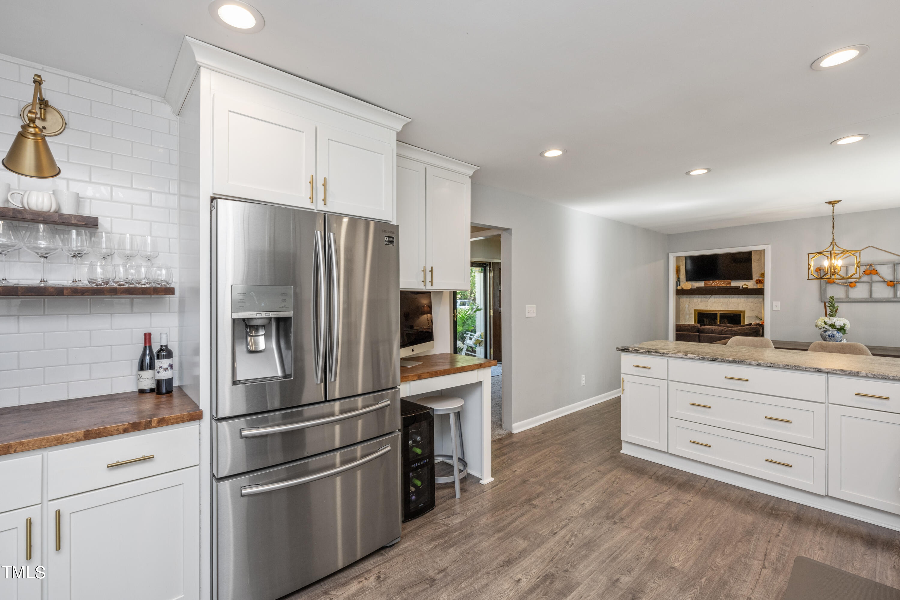 724 Hunting Ridge Road Raleigh, NC 27615 - Photo 12 of 24 a kitchen with stainless steel appliances a refrigerator sink and cabinets