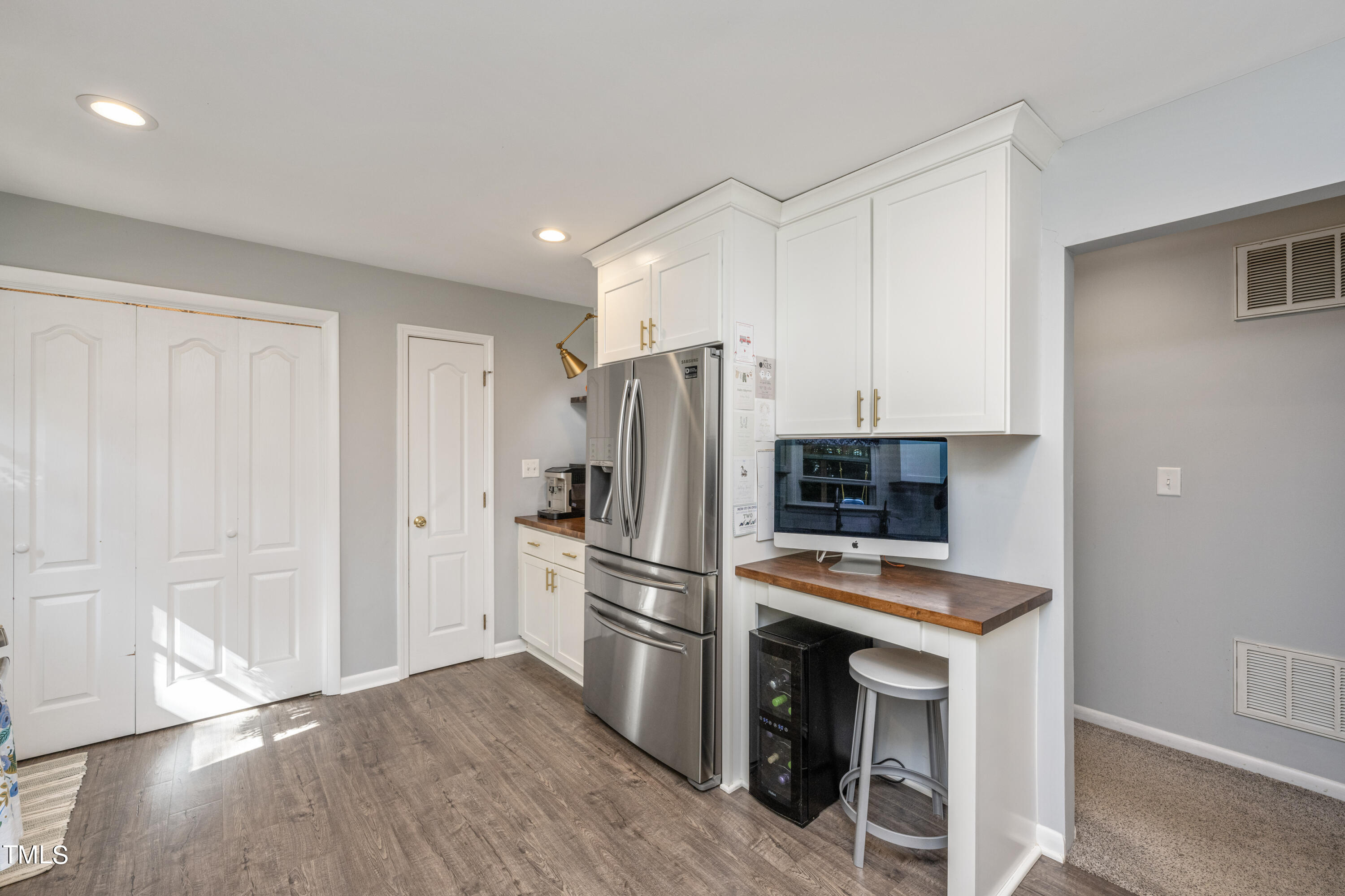 724 Hunting Ridge Road Raleigh, NC 27615 - Photo 13 of 24 a kitchen with stainless steel appliances a refrigerator and a stove top oven