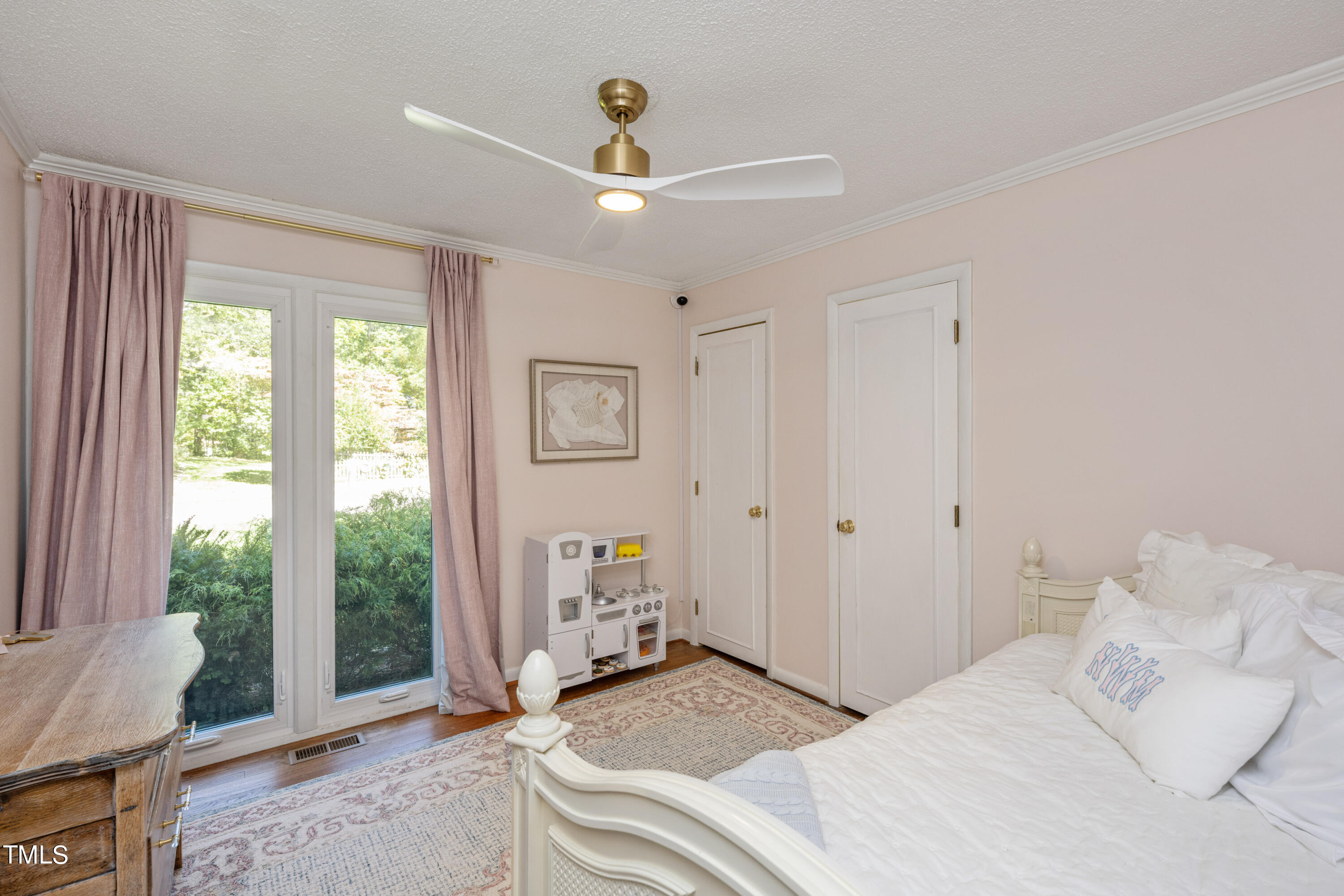 724 Hunting Ridge Road Raleigh, NC 27615 - Photo 14 of 24 a bedroom with a bed and a large window