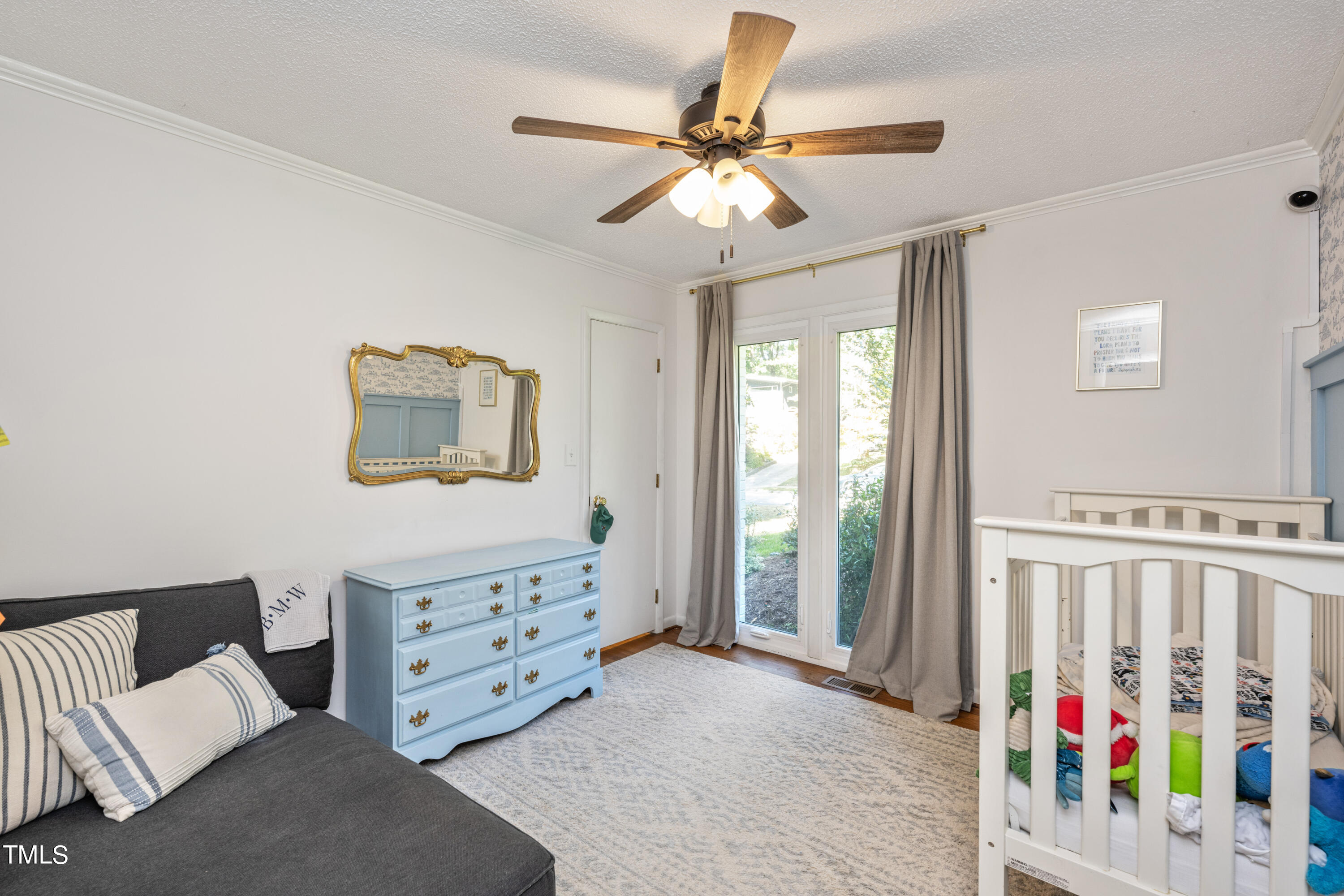 724 Hunting Ridge Road Raleigh, NC 27615 - Photo 15 of 24 a view of a bedroom with furniture and staircase