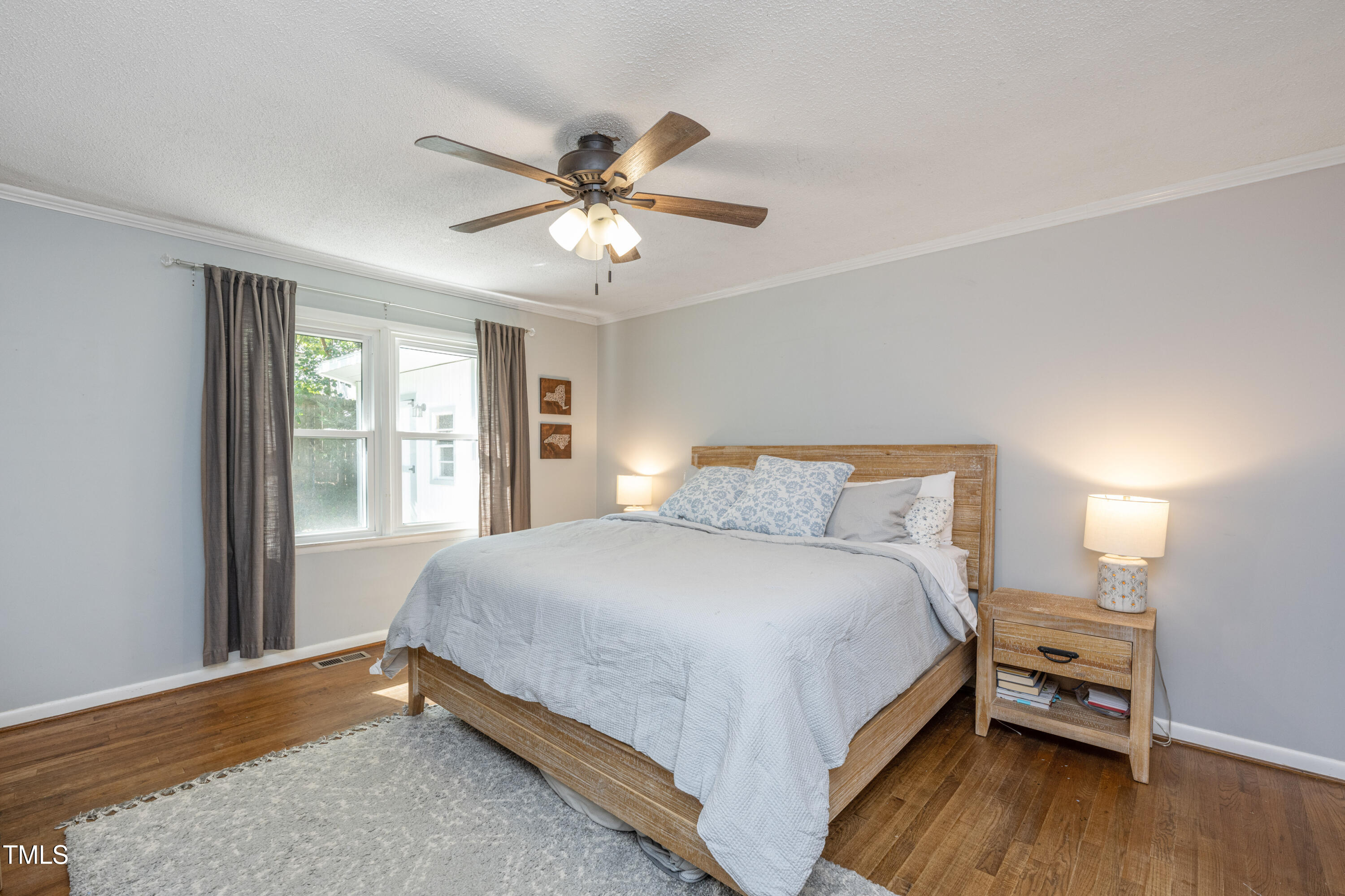 724 Hunting Ridge Road Raleigh, NC 27615 - Photo 17 of 24 a bedroom with a bed and a window