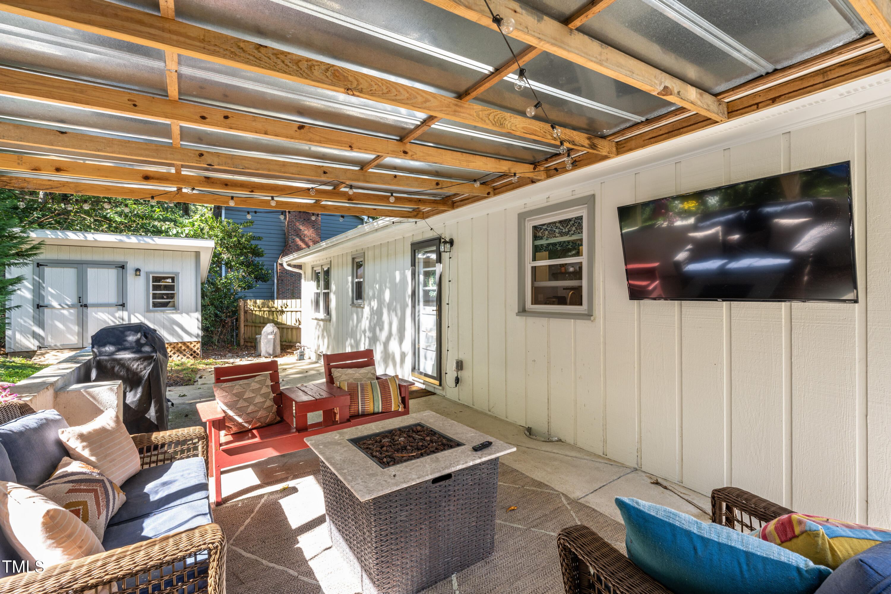 724 Hunting Ridge Road Raleigh, NC 27615 - Photo 22 of 24 a living room with furniture and a flat screen tv