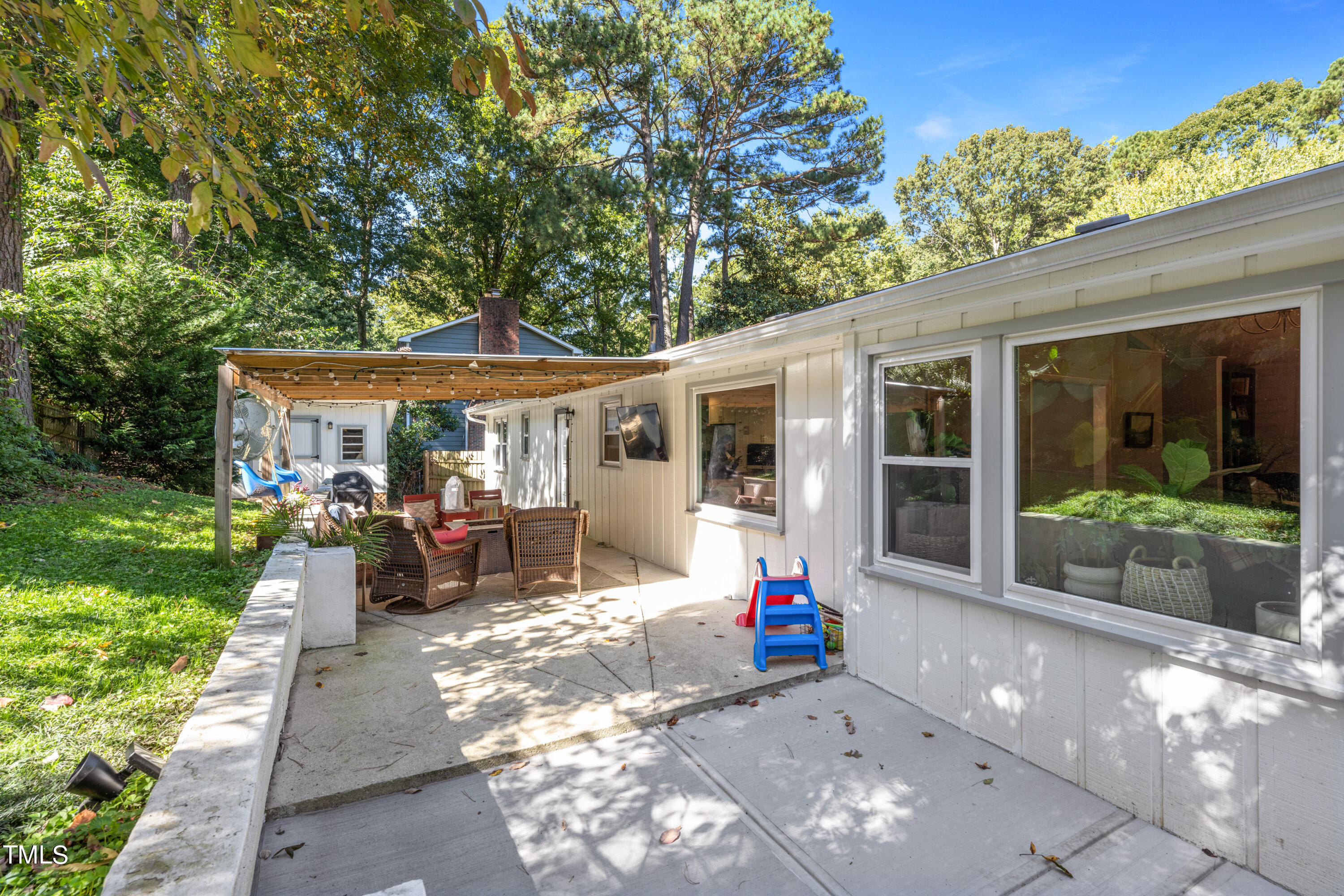 724 Hunting Ridge Road Raleigh, NC 27615 - Photo 23 of 24 a view of a house with sitting area and garden