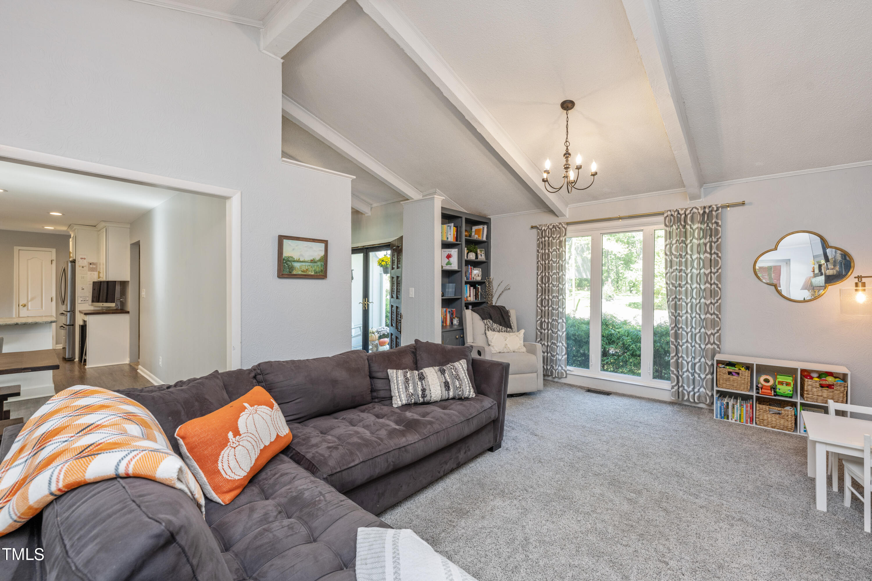 724 Hunting Ridge Road Raleigh, NC 27615 - Photo 5 of 24 a living room with furniture ceiling fan and a rug