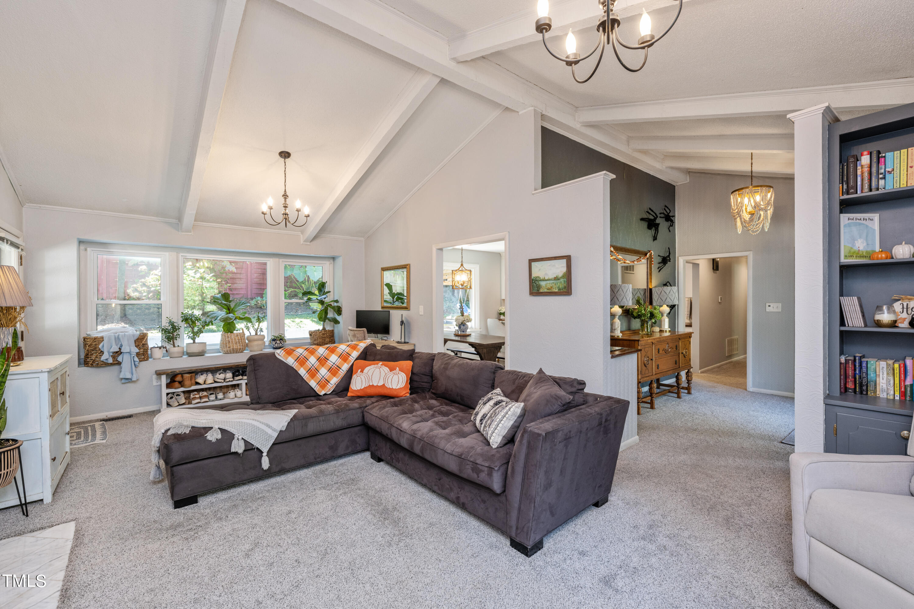 724 Hunting Ridge Road Raleigh, NC 27615 - Photo 6 of 24 a living room with furniture and a book shelf