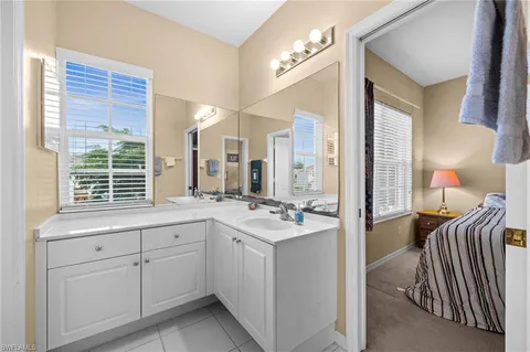 a bathroom with a toilet and a mirror