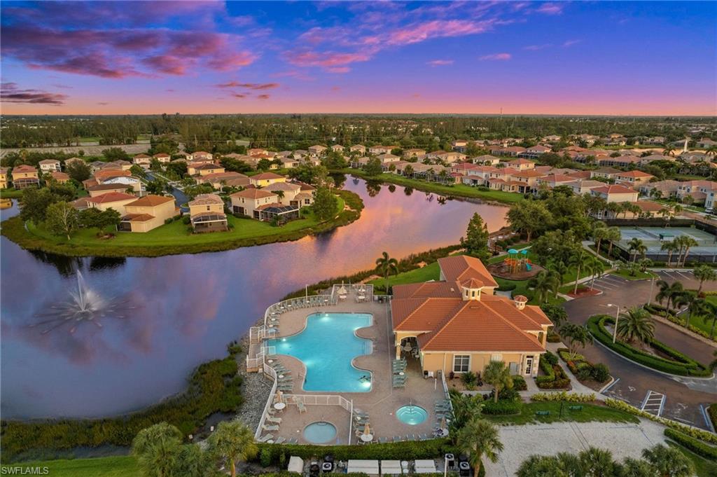 8830 Spring Mountain Way Fort Myers, FL 33908 - Photo 40 of 41 an aerial view of residential houses with outdoor space and lake view