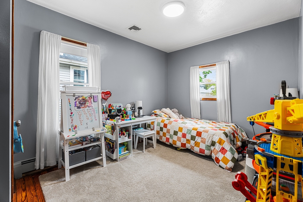 51 Cherry Street Fairhaven, MA 02719 - Photo 11 of 27 a bedroom with a bed and a window