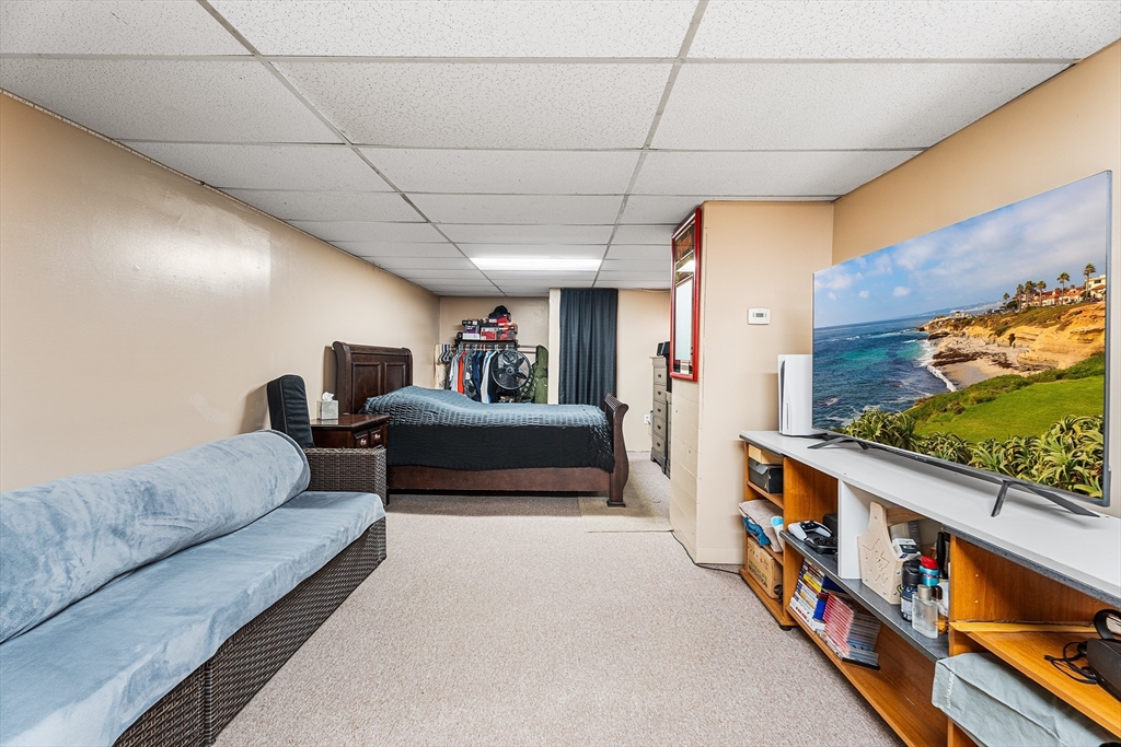 51 Cherry Street Fairhaven, MA 02719 - Photo 17 of 27 a bedroom with furniture and a bed