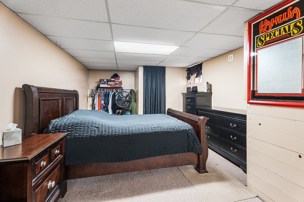 51 Cherry Street Fairhaven, MA 02719 - Photo 18 of 27 a bedroom with a bed and a closet