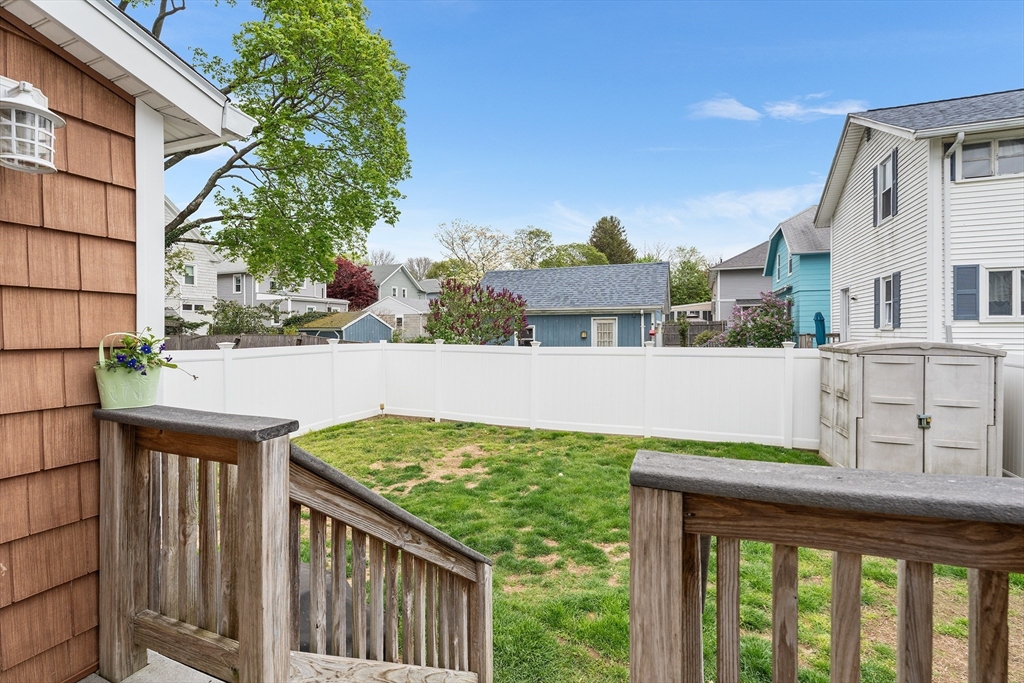 51 Cherry Street Fairhaven, MA 02719 - Photo 26 of 27 a view of a house with backyard porch and wooden fence