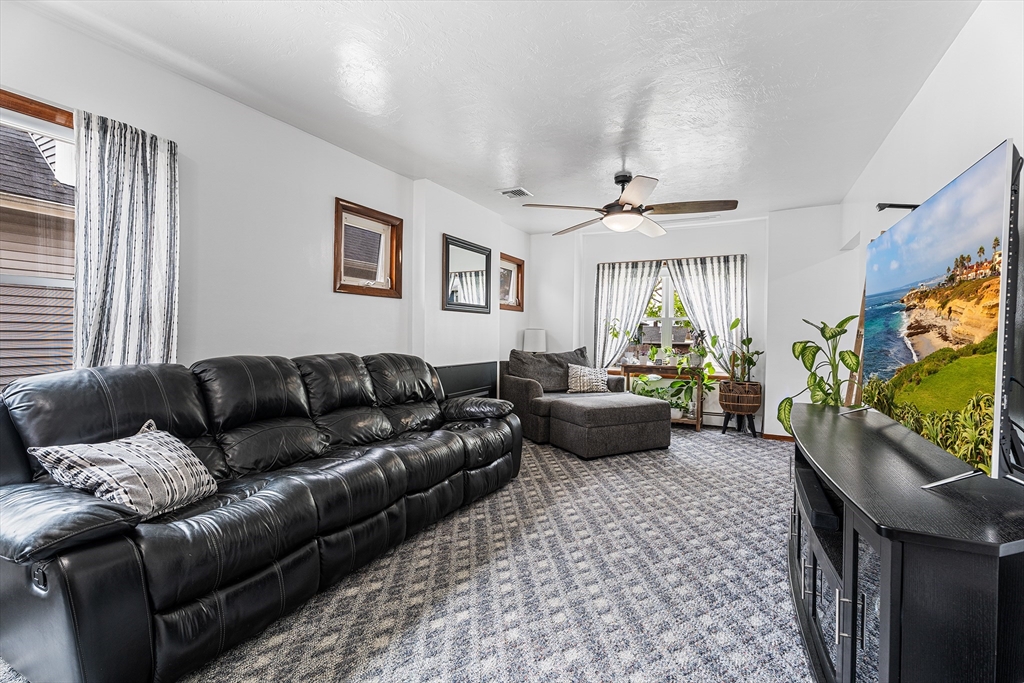 51 Cherry Street Fairhaven, MA 02719 - Photo 7 of 27 a living room with furniture and a flat screen tv