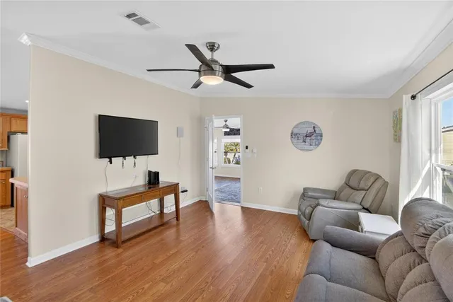 a view of a dining room with furniture window and wooden floor