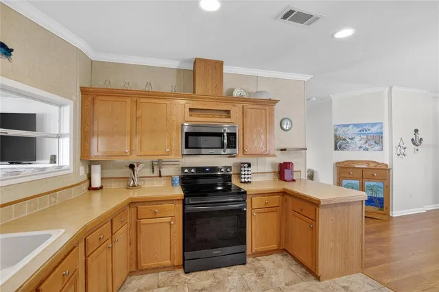 a view of a storage and utility room with washer and dryer