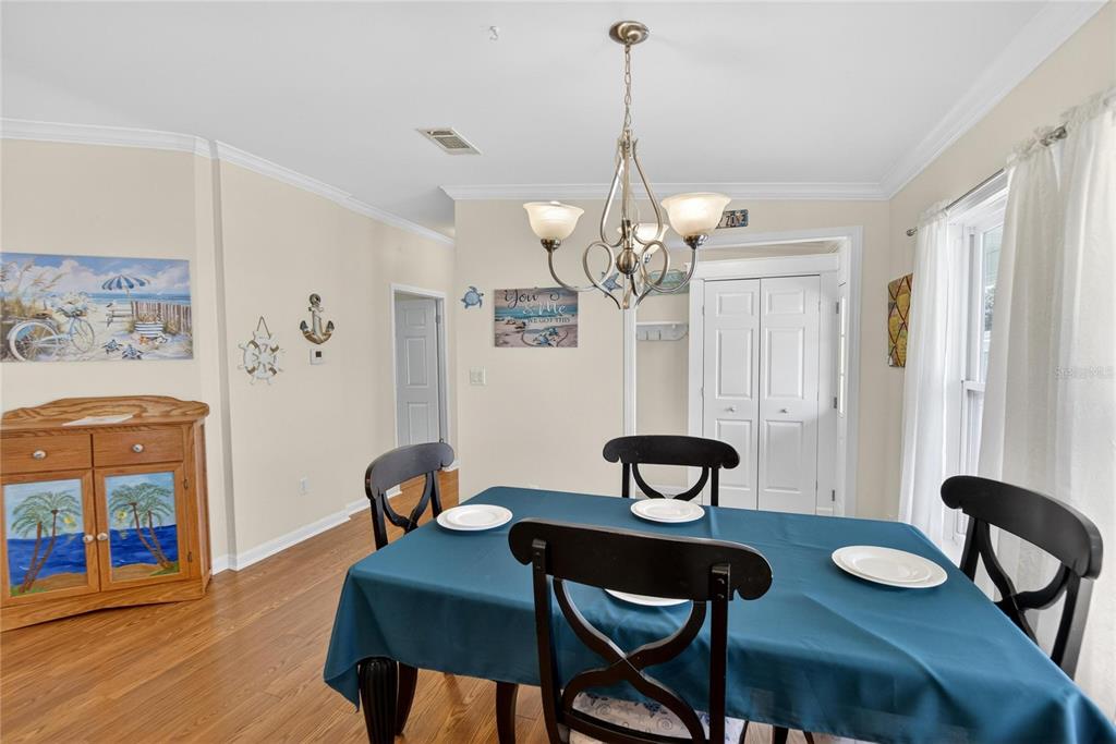37526 Rio Lane Zephyrhills, FL 33541 - Photo 22 of 58 a view of a dining room with furniture and wooden floor