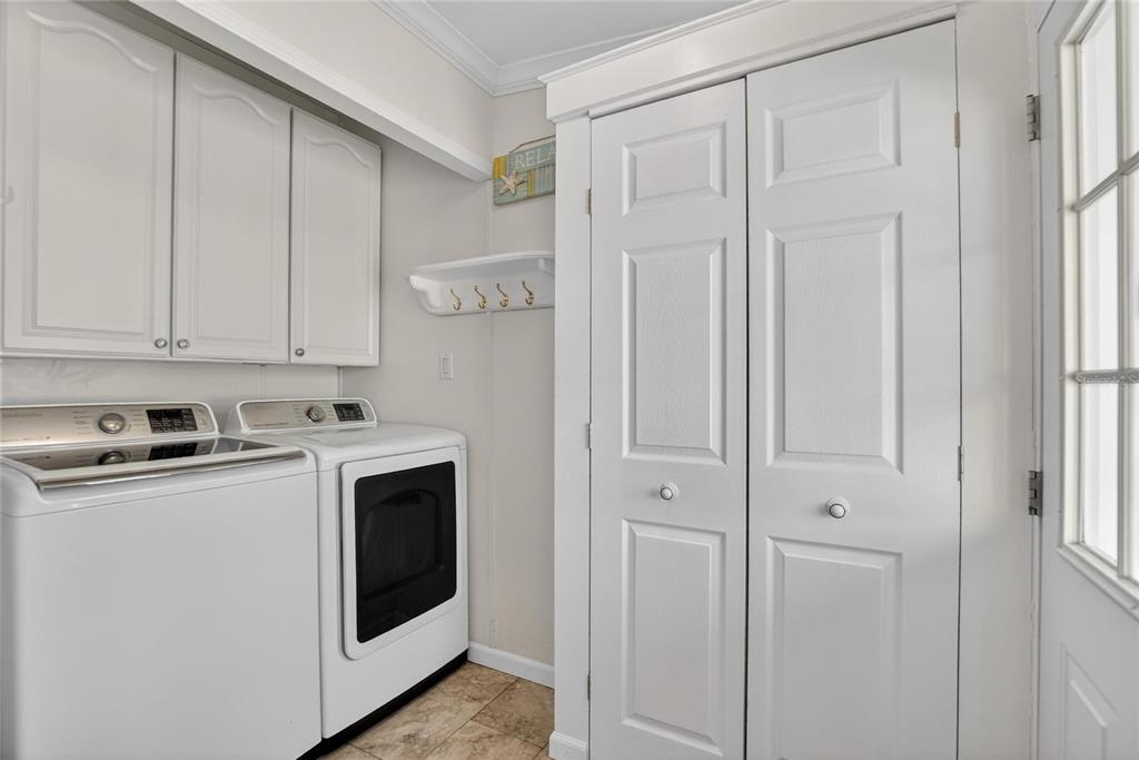 37526 Rio Lane Zephyrhills, FL 33541 - Photo 23 of 58 a view of a storage and utility room with washer and dryer