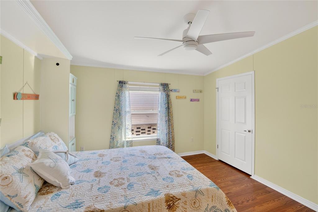 37526 Rio Lane Zephyrhills, FL 33541 - Photo 26 of 58 a bedroom with a bed and a dresser