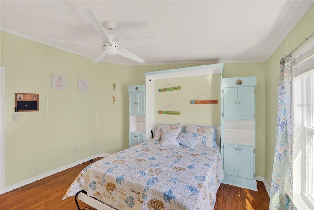 37526 Rio Lane Zephyrhills, FL 33541 - Photo 27 of 58 a bedroom with a bed and a window