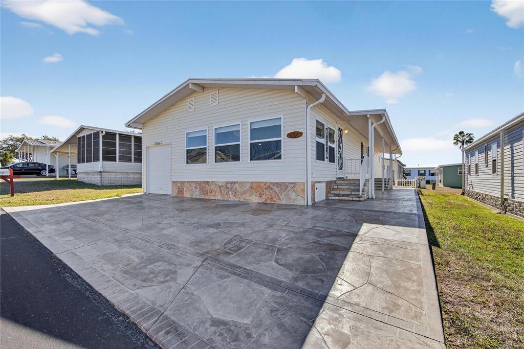 37526 Rio Lane Zephyrhills, FL 33541 - Photo 3 of 58 a view of a house with a swimming pool