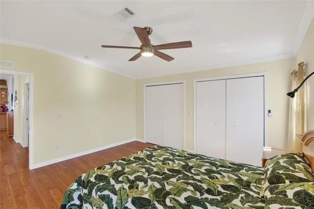 a view of a house with wooden fence