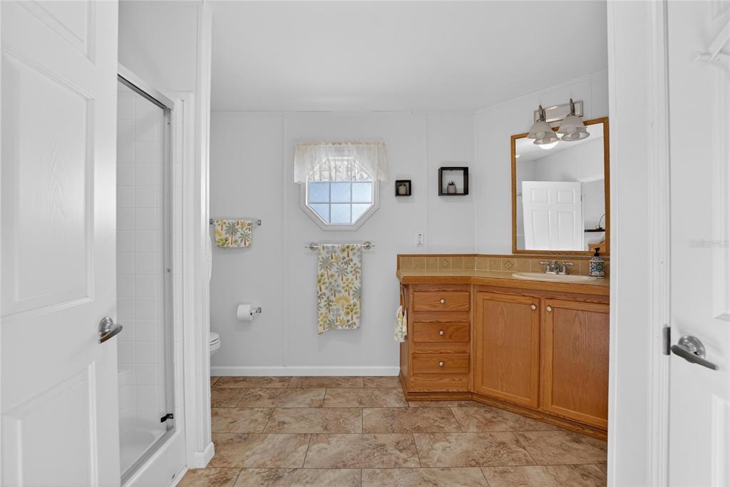 37526 Rio Lane Zephyrhills, FL 33541 - Photo 36 of 58 a view of a hallway with washer and dryer