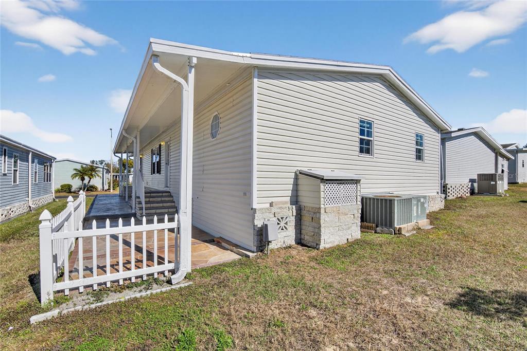 37526 Rio Lane Zephyrhills, FL 33541 - Photo 41 of 58 a view of a house with wooden fence