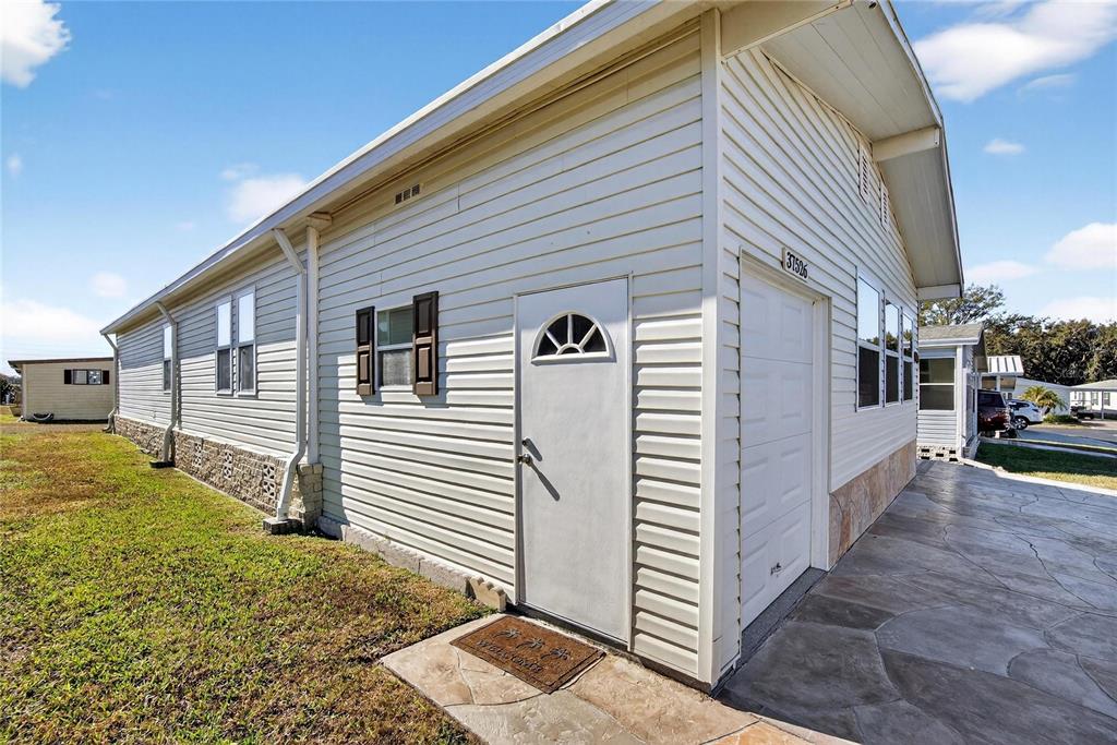37526 Rio Lane Zephyrhills, FL 33541 - Photo 44 of 58 a view of a house with a backyard