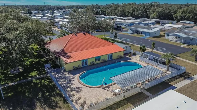 a aerial view of a house with a yard