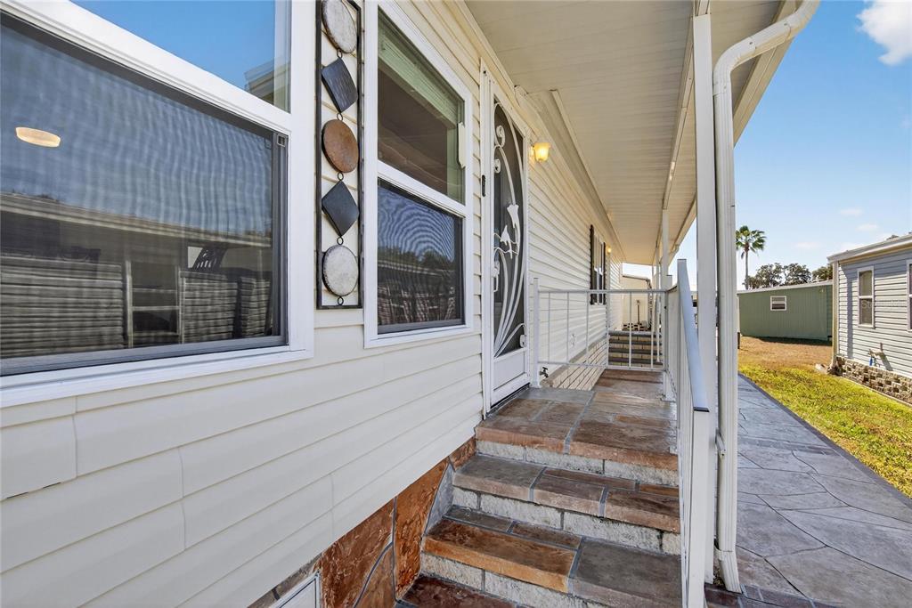 37526 Rio Lane Zephyrhills, FL 33541 - Photo 5 of 58 a view of a house with a porch