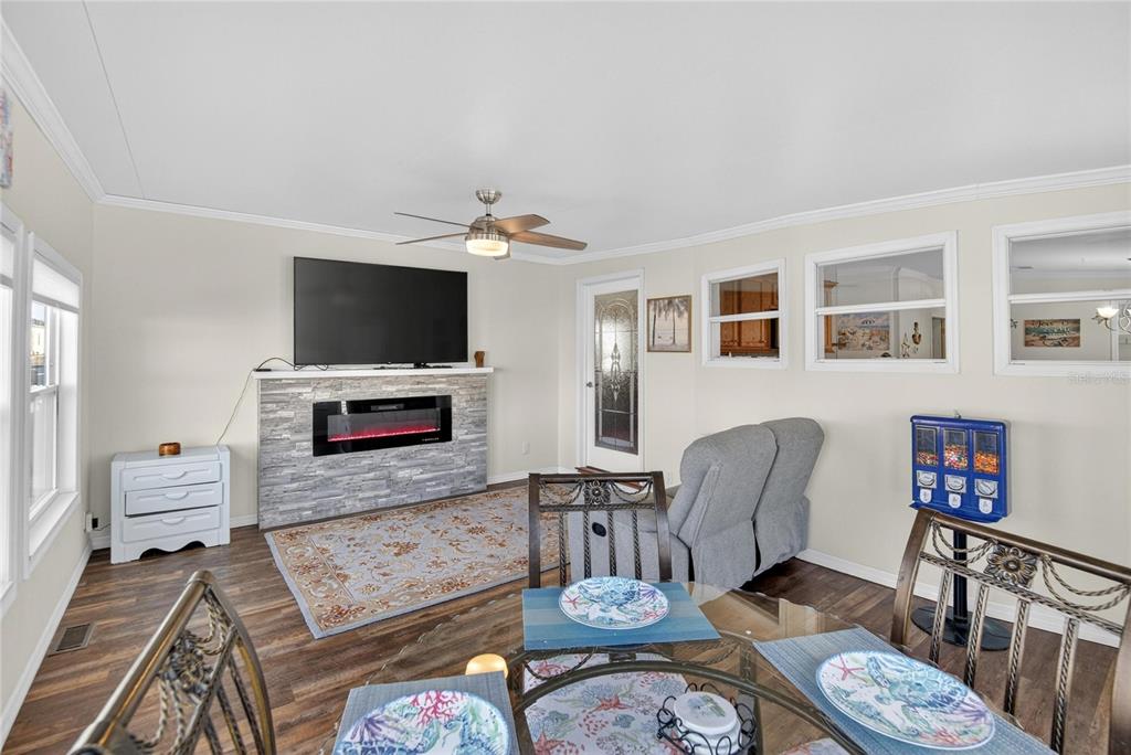 37526 Rio Lane Zephyrhills, FL 33541 - Photo 7 of 58 a living room with furniture and a flat screen tv