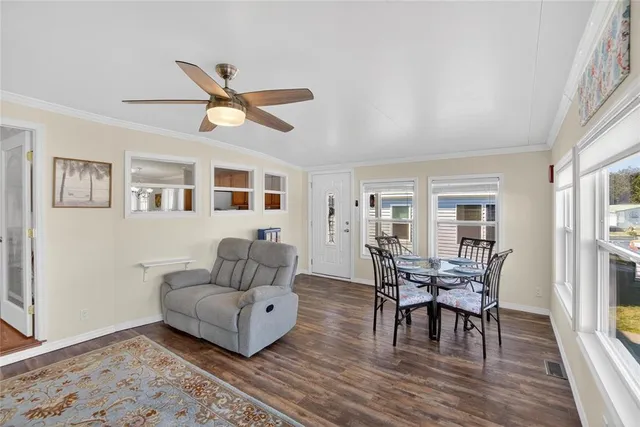 a living room with furniture fireplace and flat screen tv