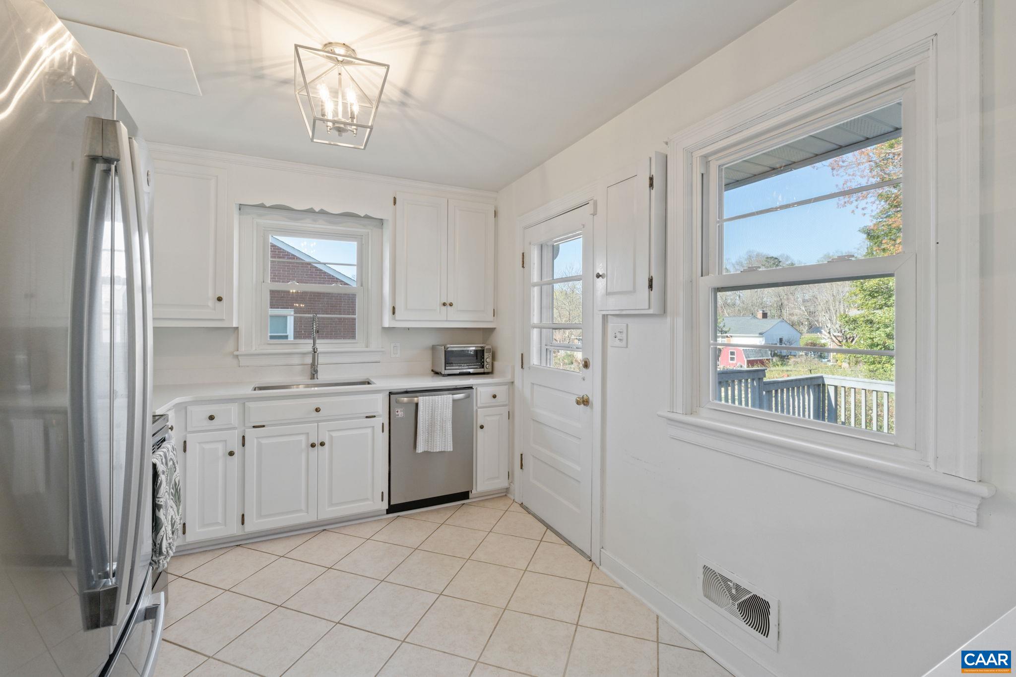 109 Camellia Drive Charlottesville, VA 22903 - Photo 13 of 49 a large white kitchen with stainless steel appliances granite countertop a refrigerator and a sink