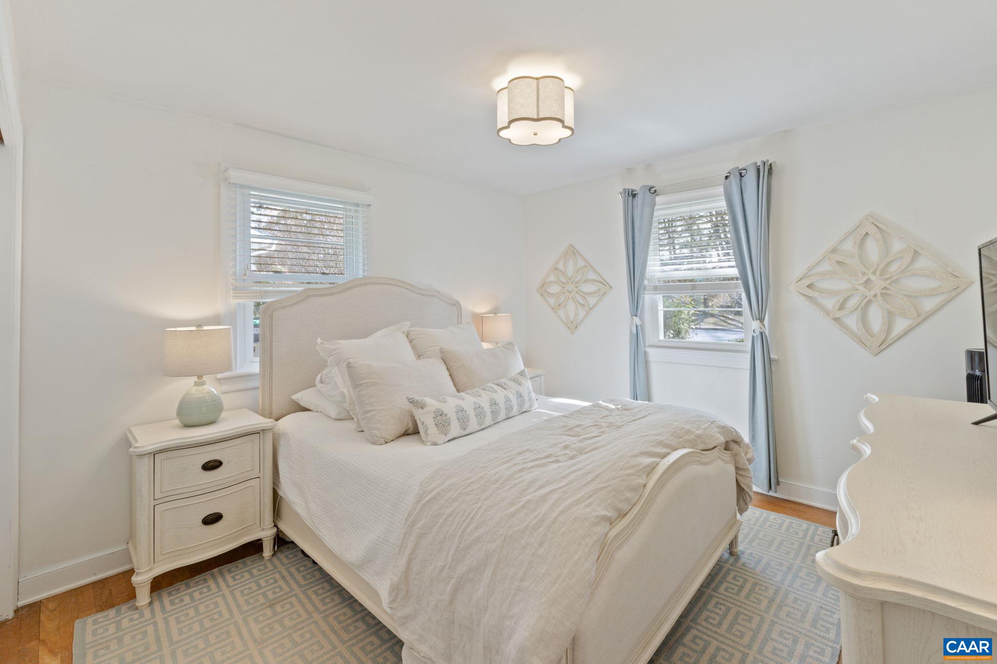 109 Camellia Drive Charlottesville, VA 22903 - Photo 17 of 49 a bedroom with a bed and a window