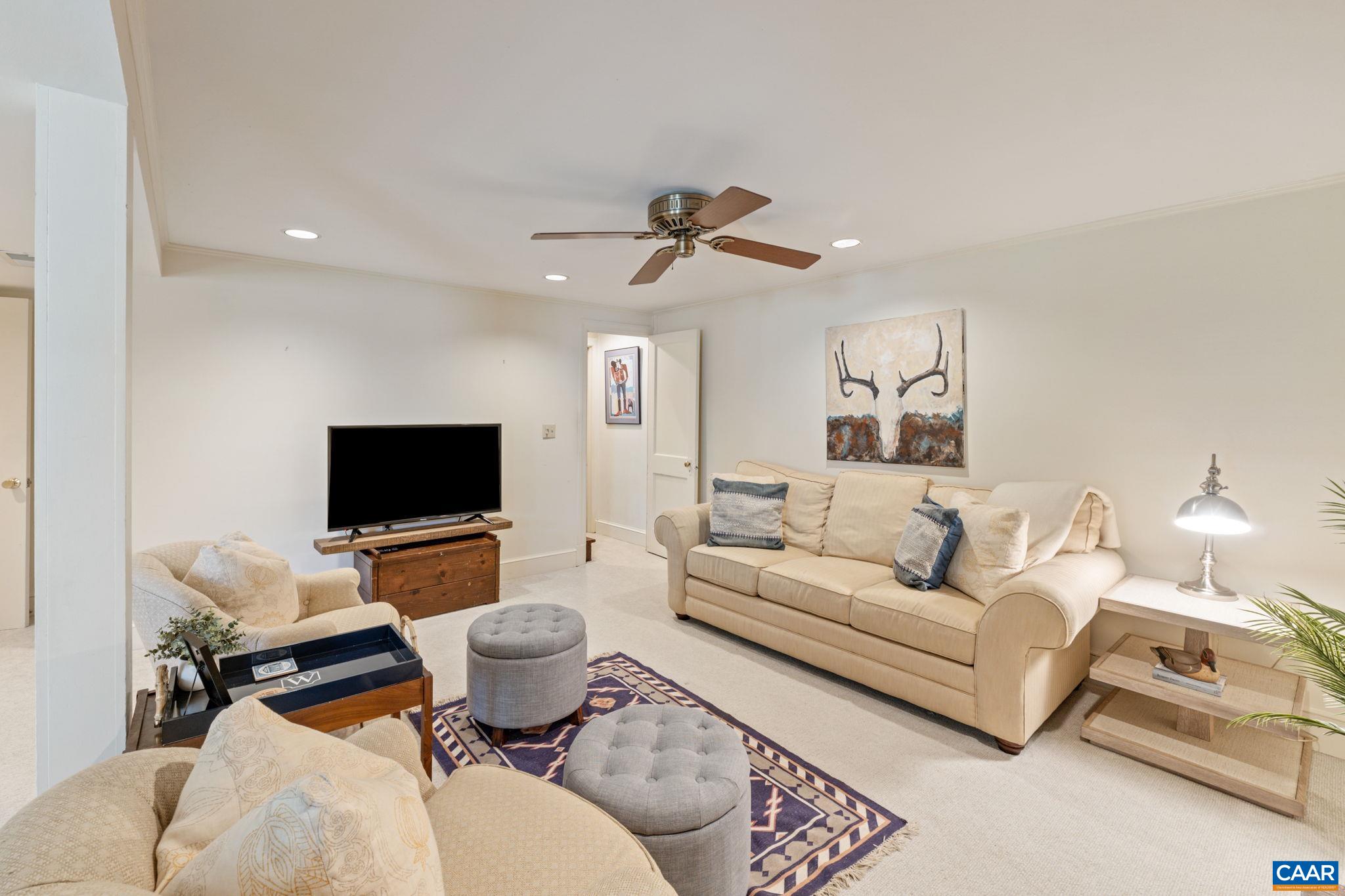 109 Camellia Drive Charlottesville, VA 22903 - Photo 25 of 49 a living room with furniture and a flat screen tv