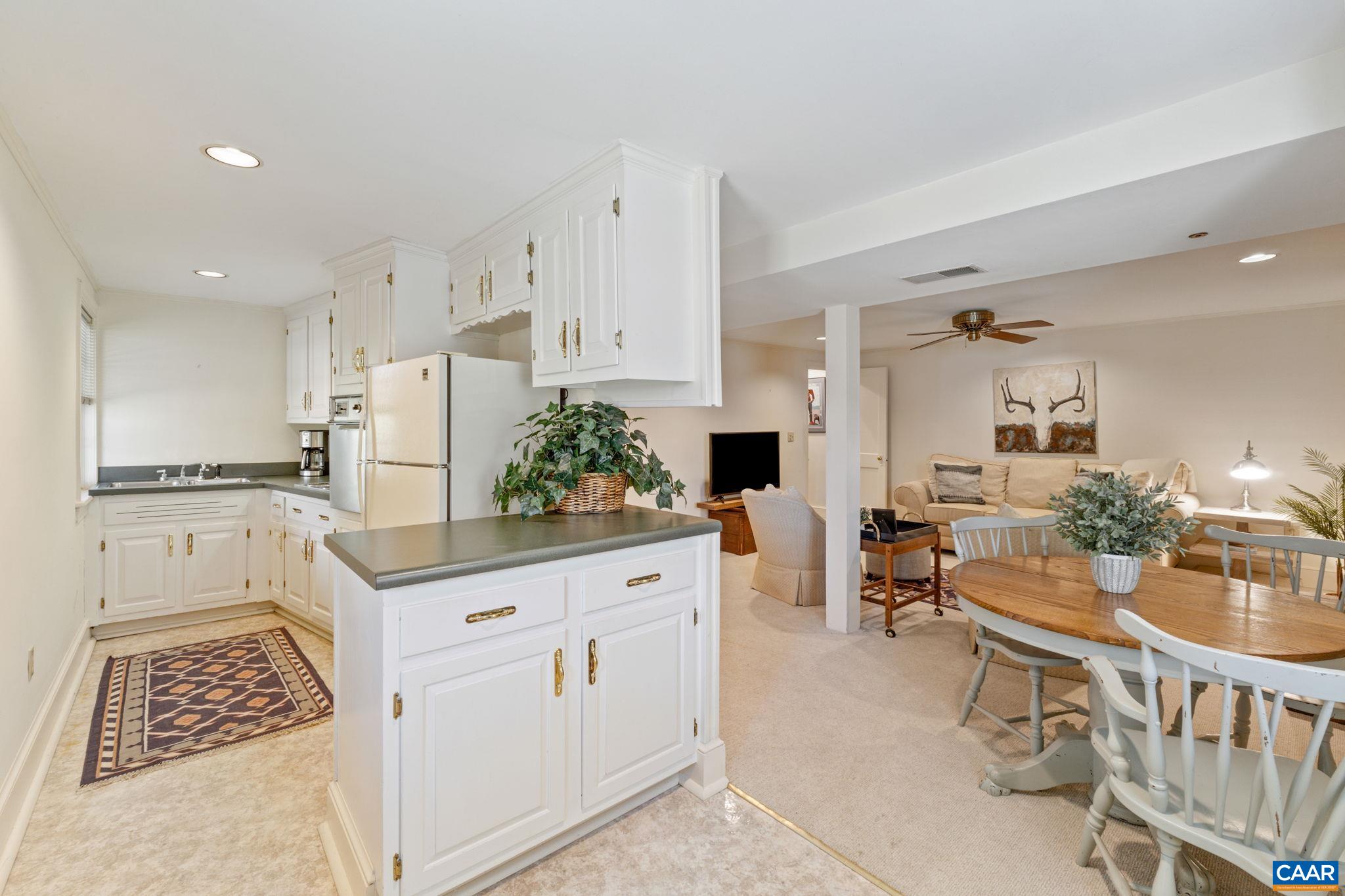 109 Camellia Drive Charlottesville, VA 22903 - Photo 27 of 49 a kitchen with white cabinets and stainless steel appliances