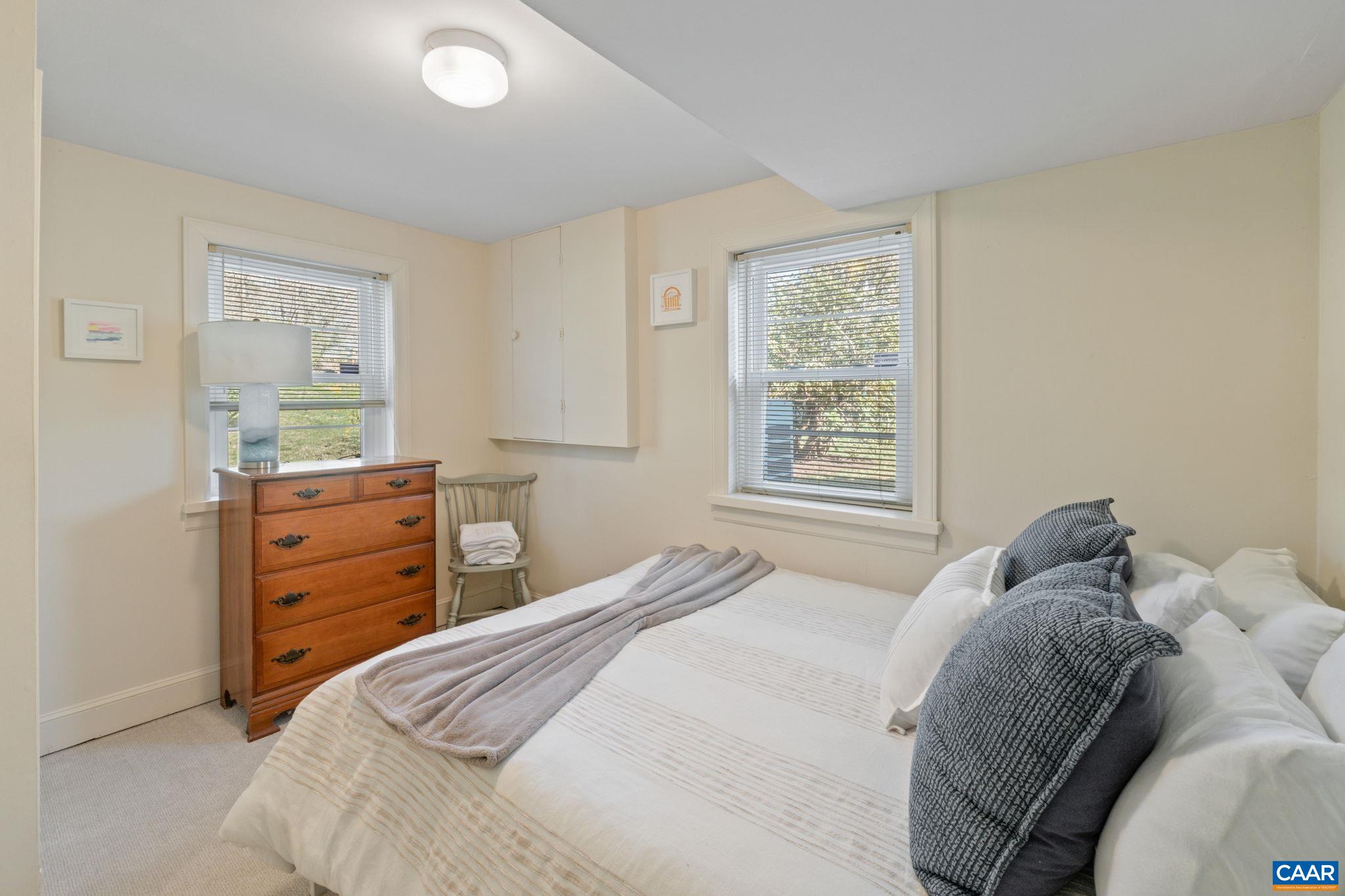 109 Camellia Drive Charlottesville, VA 22903 - Photo 31 of 49 a bedroom with a bed and a dresser