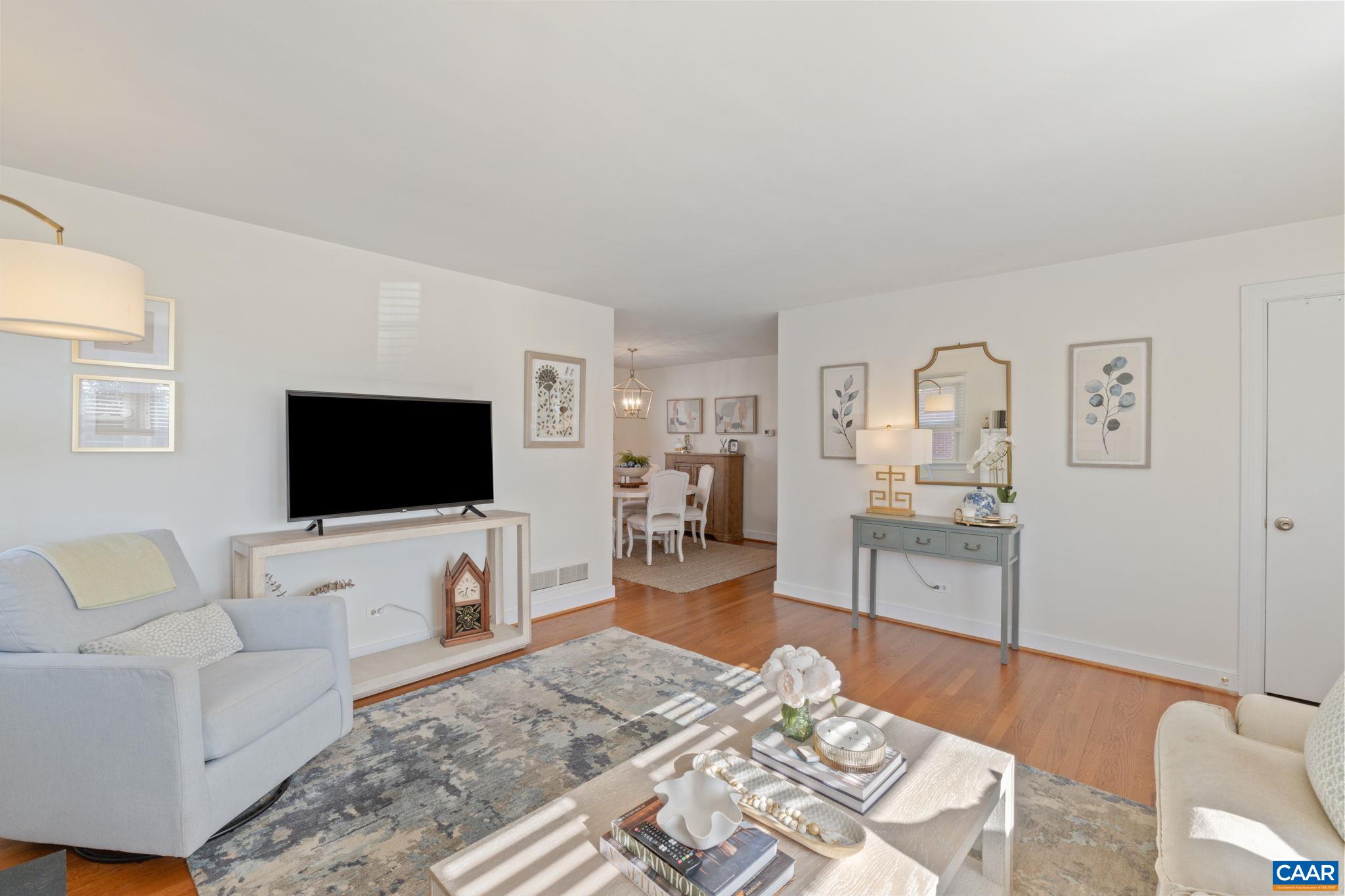 109 Camellia Drive Charlottesville, VA 22903 - Photo 9 of 49 a living room with furniture and a flat screen tv