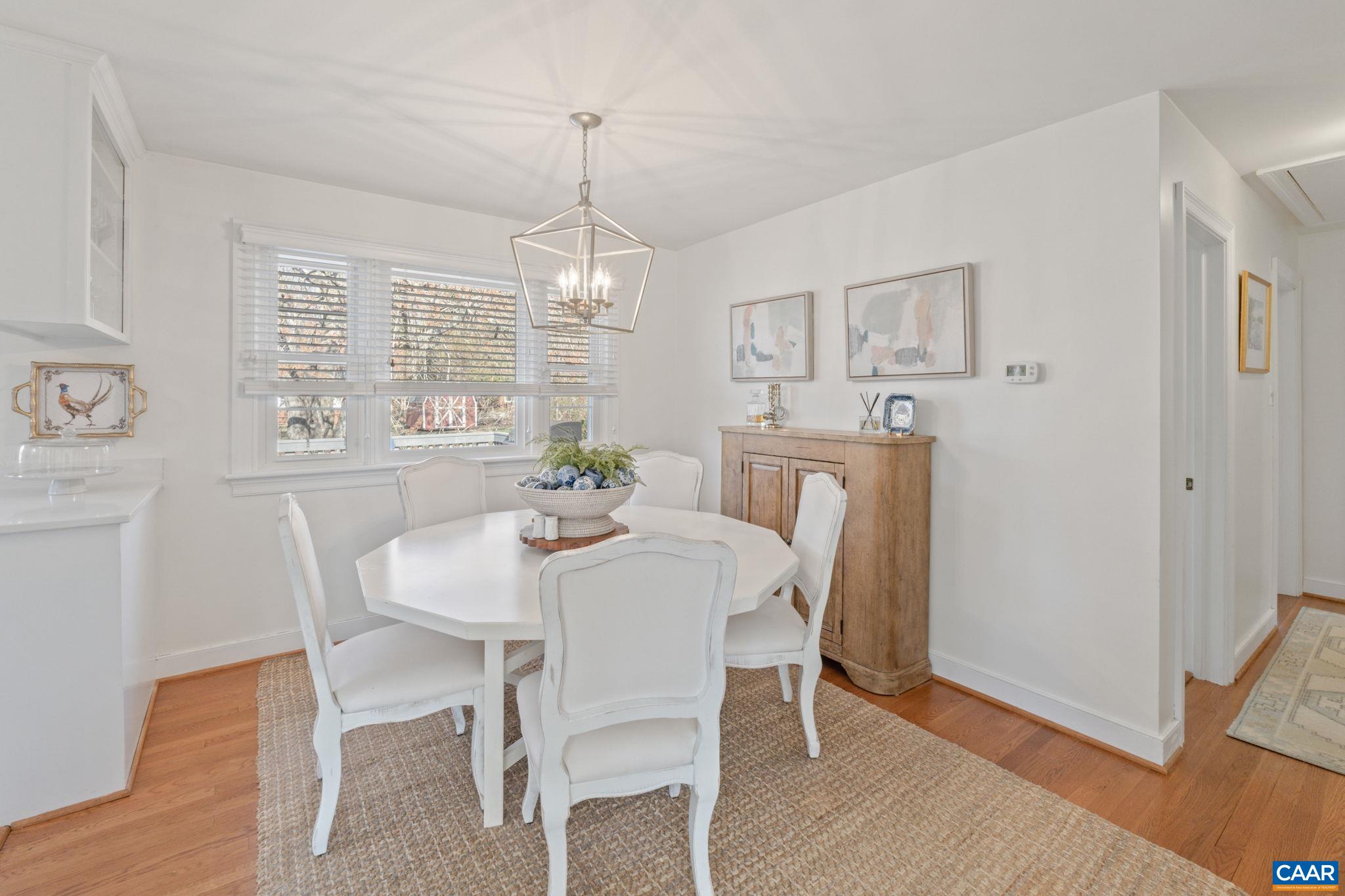 109 Camellia Drive Charlottesville, VA 22903 - Photo 10 of 49 a view of a dining room with furniture wooden floor and chandelier