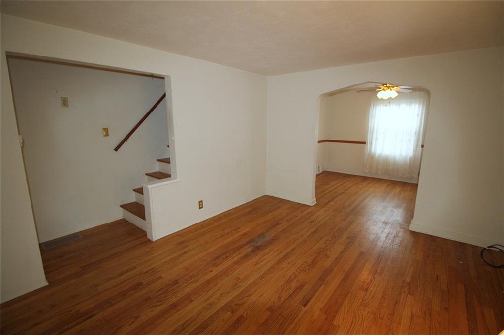 835 Middle Road Pittsburgh, PA 15234 - Photo 3 of 21 The living room features hardwood flooring and neutral decor.