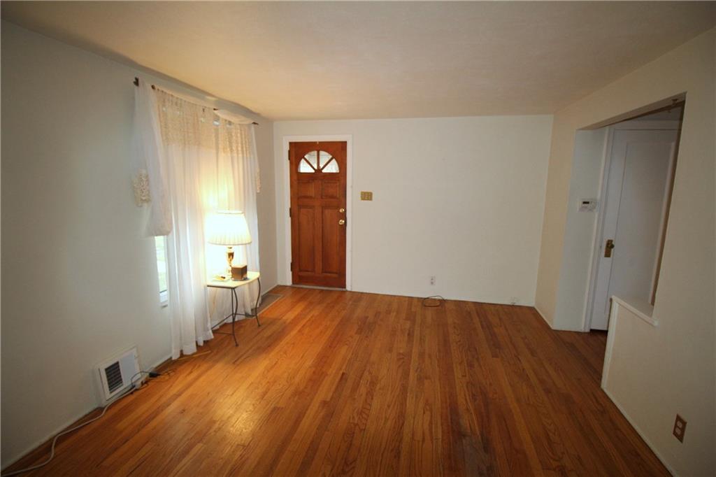 835 Middle Road Pittsburgh, PA 15234 - Photo 4 of 21 Guest closet just off living room at staircase. Large window lets in lots of natural light.