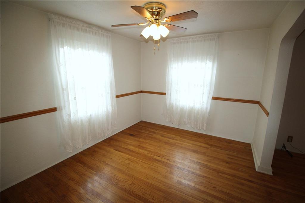 835 Middle Road Pittsburgh, PA 15234 - Photo 6 of 21 Two bright windows and a ceiling fan.