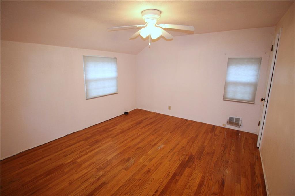 835 Middle Road Pittsburgh, PA 15234 - Photo 9 of 21 Master bedroom features a ceiling fan and exposed hardwood floors.