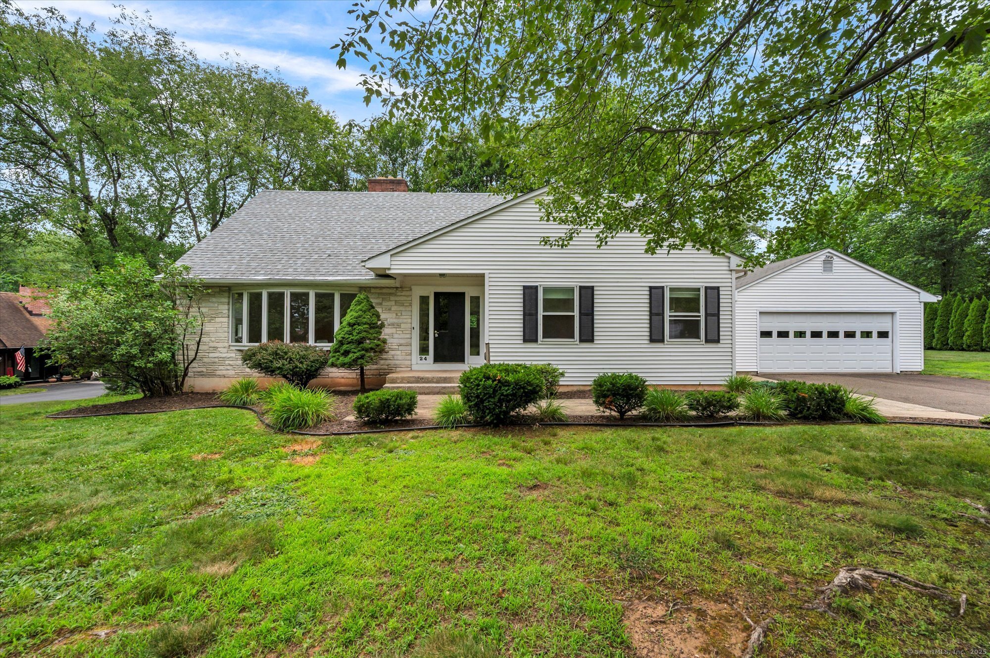 a view of a house with a backyard
