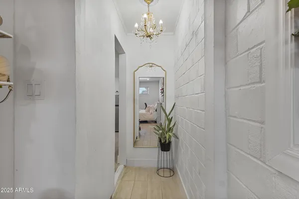 a view of a hallway with a chandelier