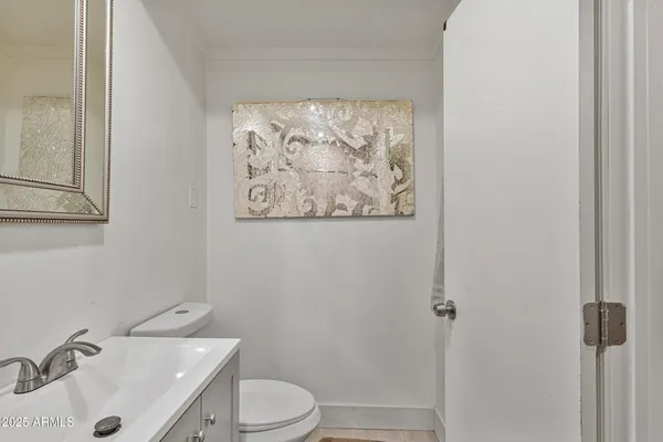 a bathroom with a sink and toilet