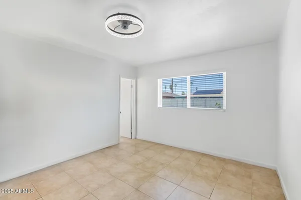 a view of a room with rack and a window