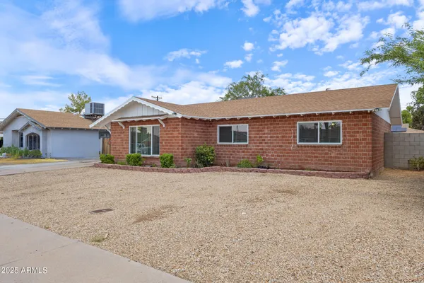 front view of a house with a dry yard