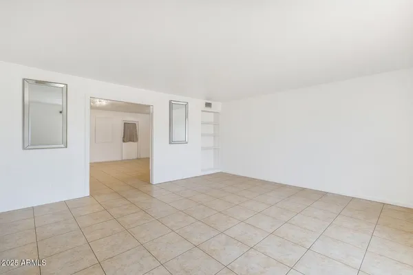 a view of an empty room and window