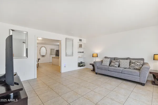 a living room with furniture and a table