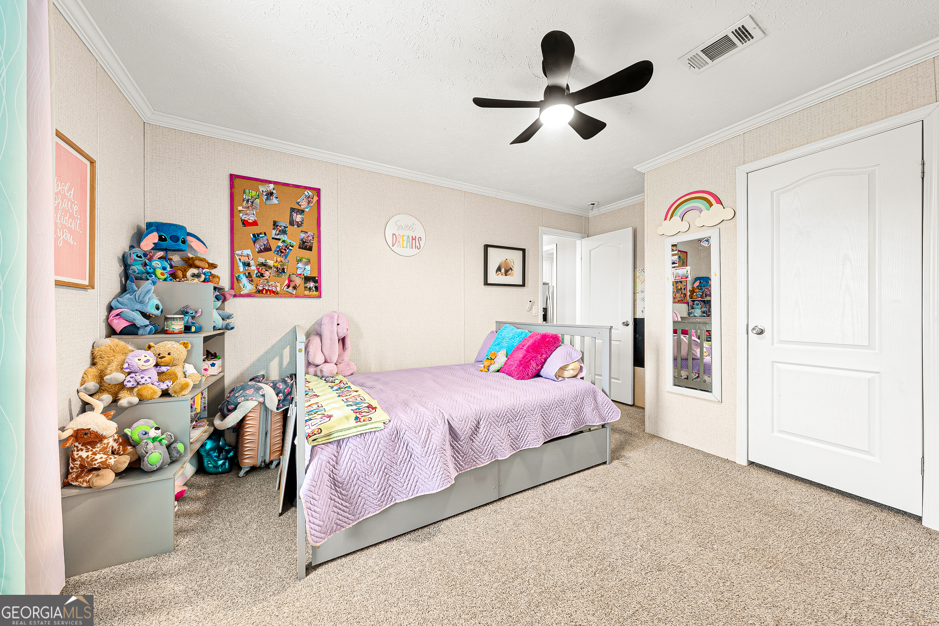 655 Lowe Road Comer, GA 30629 - Photo 14 of 19 a bedroom with a bed and a chandelier